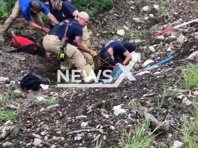 Crested Butte Fire Protection District saving a dog stucked in culvert on 19th of June 2022 in Crested Butte, Colorado. Note: Picture is a screenshot from a video (Crested Butte Fire Protection District/Newsflash)