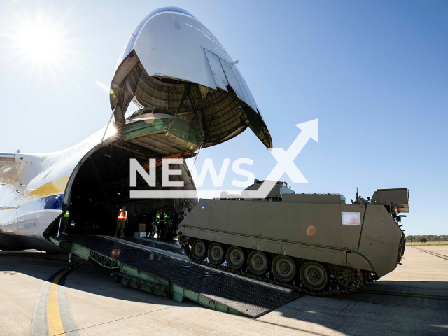 A M113AS4 Armoured Personnel Carrier bound for Ukraine is loaded onto an Antonov An-124 cargo aircraft at RAAF Base Amberley in Queensland, Australia. Note:  Photo from Australian Ministry of Defence. (Australian Ministry of Defence/Newsflash)