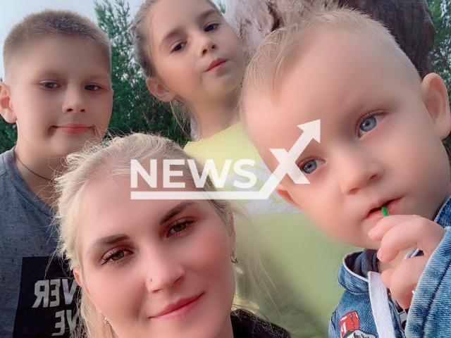 Ksenia Tokareva, 32, a mother of six, who was allegedly beaten to death by her boyfriend in Beloretsk, Russia on 17th June 2022, was pictured with unidentified children. Note: Private picture (Ksenia Sevostyanova (Tokareva)/Newsflash)