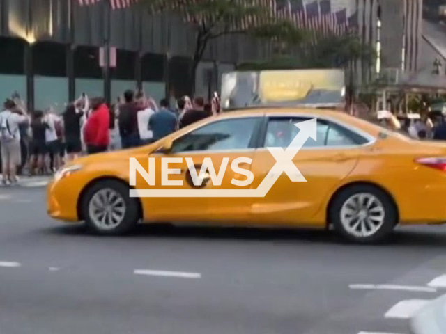 Scores of people block busy streets in New York to take photos of the sunset. Note: Photo is a screenshot from the video (@illsvvs/Newsflash)