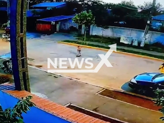 The moment when the 4-year-old child from Buftea, who was riding on a scooter, was hit by a car in Romania. Note: Picture is a screenshot from a video (Newsflash)