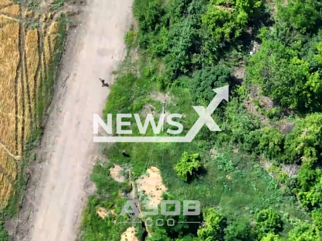 Soldiers of the Azov Special Purpose Regiment destroyed a dugout of the Russian military with the help of a combat drone, in Ukraine, in June, 2022. Note: This picture is a screenshot from the video (@slipo_ck/Newsflash).