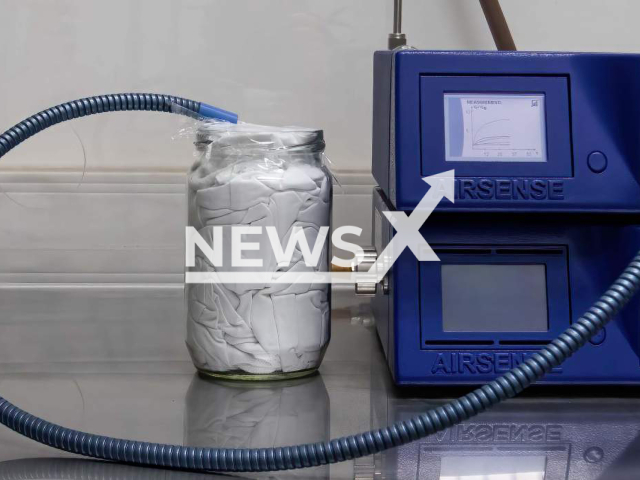 The electronic nose used in the research is "smelling" a T-shirt in a jar at the Weizmann Institute of Science in the city of Rehovot in Israel. Note: Licensed photo. (Weizmann Institute of Science/Newsflash)