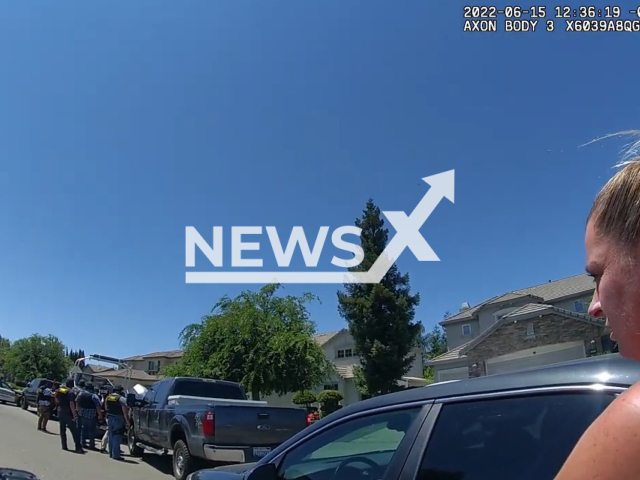 Woman explains to police officer what kind of dogs are living at suspects home on the 15th of June 2022 in Ripon, California. Note: Picture is a screenshot from a video (San Joaquin County Sheriff's Office/Newsflash)