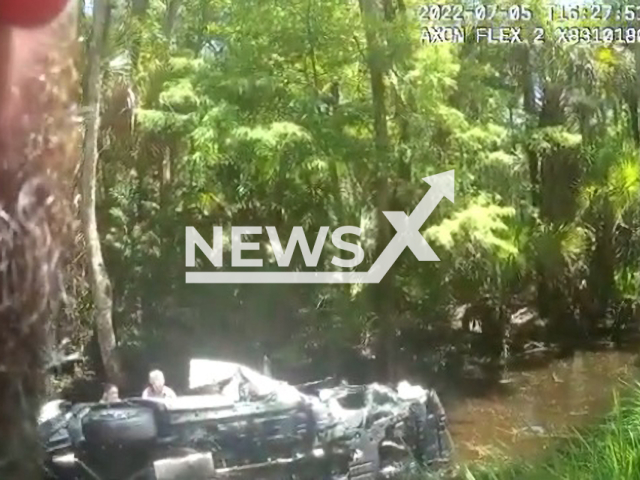 Officer's bodycam showing the  submerged vehicle, on the 5th of July, in Volusia County, Florida. Note: Picture is a screenshot from a video (Volusia Sheriff's Office/Newsflash)