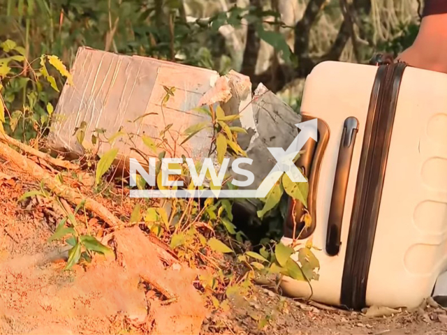 The suitcase in which the head and the legs of the dismembered body wrapped in a sheet were found in Caieiras, Sao Paulo in Brazil, in July 2022. Note: Photo is a screenshot from a video(Newsflash).