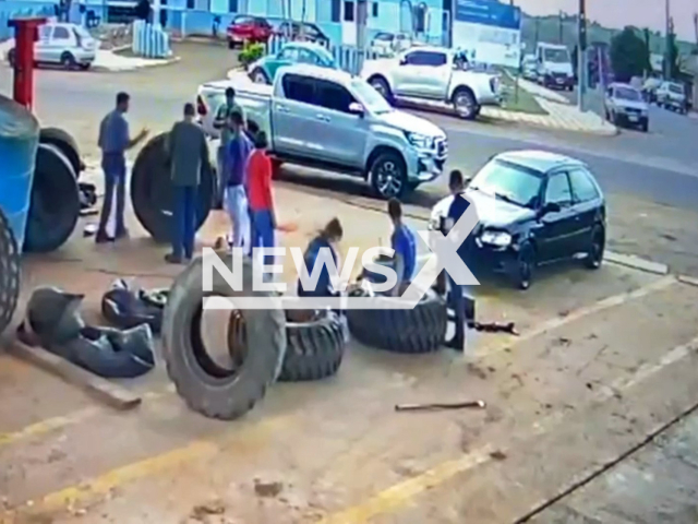 Man thrown in the air after a tire he was sitting on exploded in Parana, Brazil in July 2022.Note: This picture is a screenshot from the video (Newsflash).