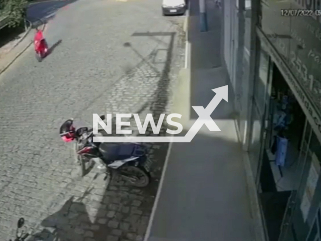 Motorcyclist thrown from the motorcycle after running over a loose cobblestone in Sumidouro, Rio de Janeiro in Brazil in July 2022. Note: This picture is a screenshot from the video (Newsflash).