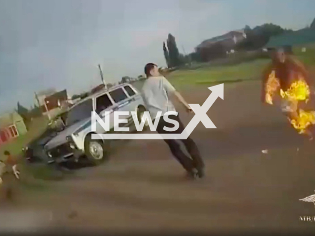 A man who was allegedly drunk doused a traffic police with gasoline and set him on fire in Kugarchinsky District in the Republic of Bashkortostan, Russia. Note: Photo is a screenshot from the video (Ministry of Internal Affairs of Russia/Newsflash)