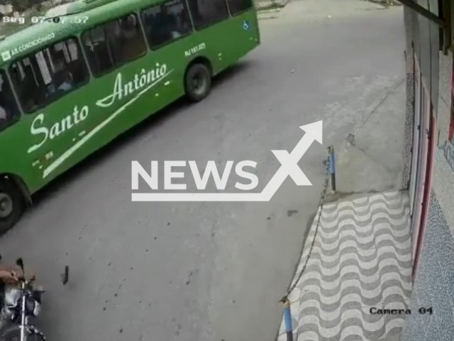 Motorcyclist is saved by helmet after falling under bus wheel and having head crushed under wheel, in Belford Roxo, Brazil, on 18th July. Note: Picture is a screenshot from a video (Newsflash)