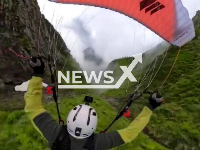 Lehart Eriksen, 25, sky flying in the Tjugatoten ravine, in Balestrand, Norway. Note: Photo is a screenshot from the video (@leharteriksen/Newsflash)