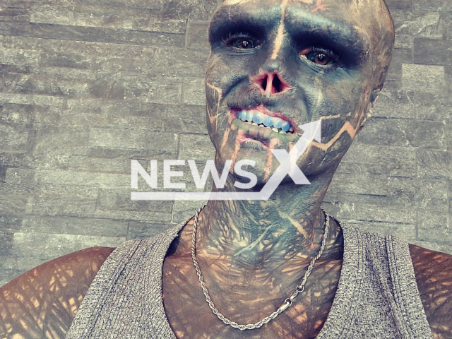 Frenchman, Anthony Loffredo, 33, who is doing body modification to turn into a 'black alien' and who has said he's debating chopping off part of his leg, poses in undated photo.

 Note: Private photo.  (@the_black_alien_projec/Newsflash)