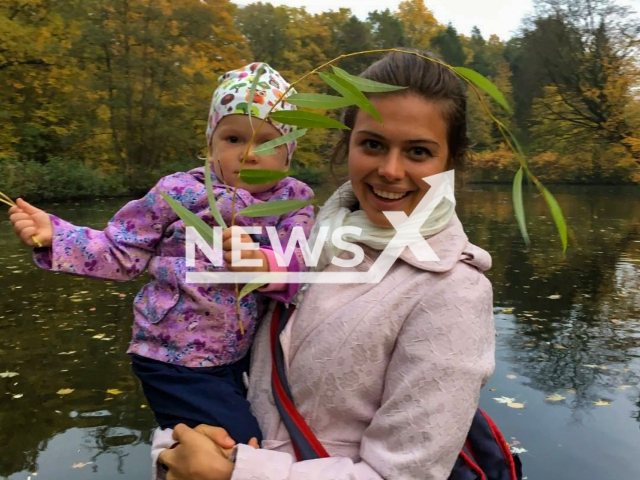 Russian, Yekaterina Baumann, who was found dead in Bremerhaven, north-western Germany, poses with an unidentified child, in undated photo. Note: Private picture (@ekaterina.baumann/Newsflash)