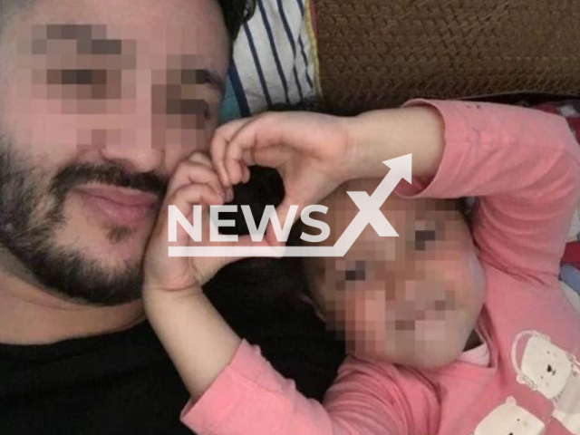 A girl called Diana, 8, poses with her father Georgy, 41, from Russia, who is in a custody battle with the 29-year-old lesbian mother Margaret over the child moving to Australiain in undated photo. Note: Private photo. (Newsflash)