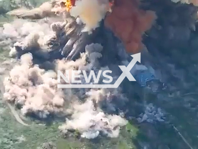 Russian ammunition depot explodes as it is destroyed by the Ukraine Armed forces in the Kharkiv region in Ukraine in undated footage. Strategic Communications Department has also claimed that Russian military personnel was destroyed during the attack.  Note: This picture is a screenshot from the video (@AFUStratCom/Newsflash).