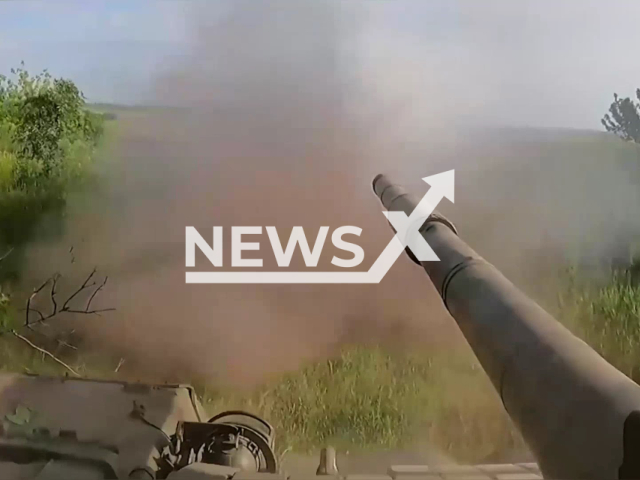 A DPR tank fires on the Ukrainian military positions in Ukraine in undated footage. A Ukrainian military platoon was allegedly destroyed by DPR tanks, according to the Russian Ministry of Defense. Note: Photo is a screenshot from the video (Ministry of Defense of Russia/Newsflash)