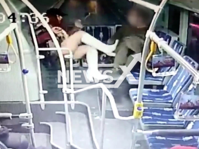 A woman kicks a man several times on a bus in Istanbul, Turkey, in undated footage. She claims that the man who sat next to her harassed her. Note: Photo is a screenshot from the video (Newsflash)