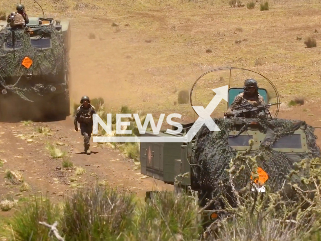 U.S. Marine Corps Cpl. Juan del Haro, Texas native, and artillery cannoneer with 5th Battalion, 11th Marines, 1st Marine Division, guides a High Mobility Artillery Rocket System at Pōhakuloa Training Area, Hawaii, on Monday, July 18, 2022. Approximately 25,000 personnel are participating in RIMPAC from June 29 to Aug. 4 in and around the Hawaiian Islands and Southern California. Note: This picture is a screenshot from the video (U.S. Navy/Newsflash).