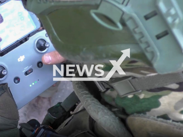 Soldier of the People`s Militia of the DPR works with remote control of UAV (unmanned aerial vehicle) in Avdiivka direction, Ukraine in an undated photo. Artillerymen of the DPR used UAVs with a high-explosive fragmentation projectile against Ukrainian troops. Note: Picture is a screenshot from a video (@nm_dnr/Newsflash)