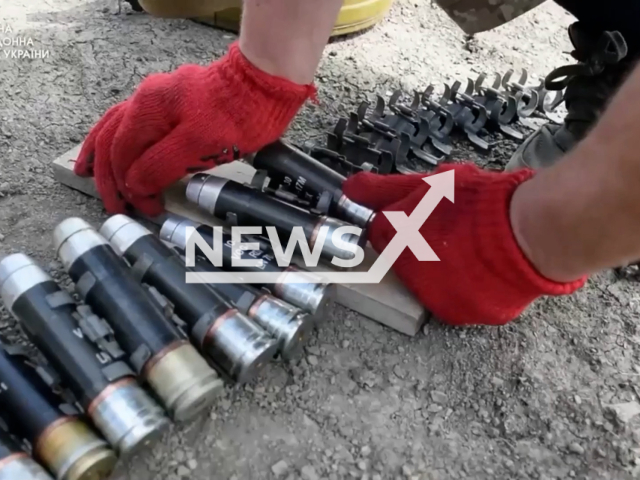 Soldier of the State Border Service of Ukraine loads cartridges into machine gun belt near the front line in Donetsk region, in Ukraine in an undated photo. The President of Ukraine, Volodymyr Zelenskyy, honored 37 border guards with state awards according to the Presidential Decree No. 548/2022 from Monday, Aug. 1, 2022. Note: This picture is a screenshot from the video (@DPSUkraine/Newsflash).