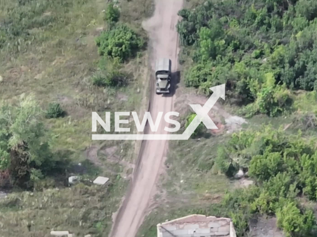 Truck with Russian ammunition goes down the road near the Russian borders, Ukraine in an undated photo. As a result of the combat operation of the Special Operations Detachment Azov Kharkiv, 7 trucks with ammunition and 2 security vehicles of Russian occupiers were destroyed.  Note: Photo is a screenshot from the video (@sso_azov_kharkiv/Newsflash)