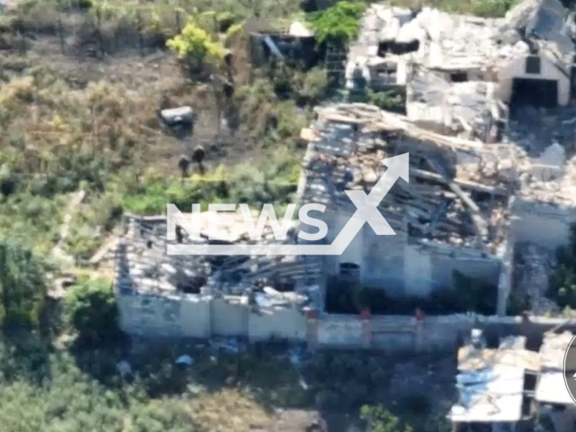 Picture shows Russian soldiers moving to find shelter in nearby buildings in Ukraine in undated footage.
The Russian soldiers were destroyed, after being ambushed by the soldiers from the 503 Separate Marine Corps Battalion according to Ukrainian officials. 
Note: Picture is a screenshot from a video (@503obmp/Newsflash)