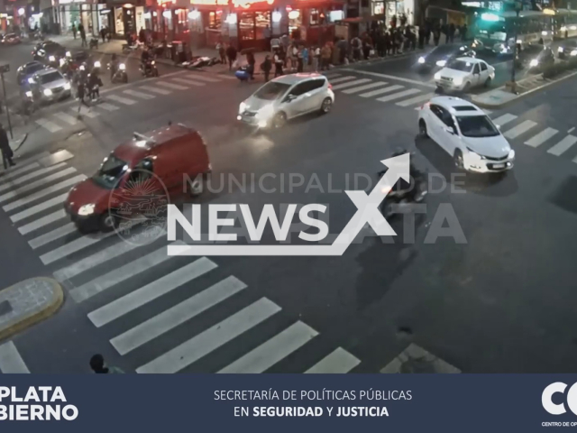 A motorcyclist collides with a motorist in La Plata, Argentina, Friday, Aug. 5, 2022. Two people were thrown, and one of them suffered serious injuries after falling on the roof of the car. Note: Picture is a screenshot from a video (COM La Plata/Newsflash)