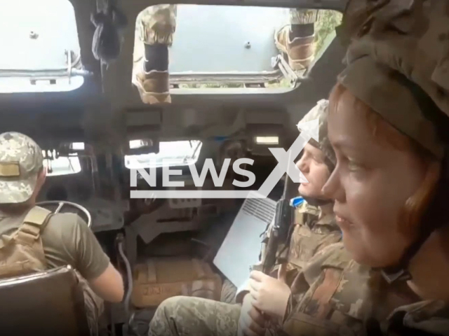 Signalmen paratroopers of the 79th separate amphibious assault brigade, including one female soldier, sit inside of a military vehicle, Ukraine in an undated photo. The 79th Air Assault Brigade, based in Mykolaiv, is a formation of the Ukrainian Air Assault Forces. Note: Photo is a screenshot from the video (@79AMBUA/Newsflash)