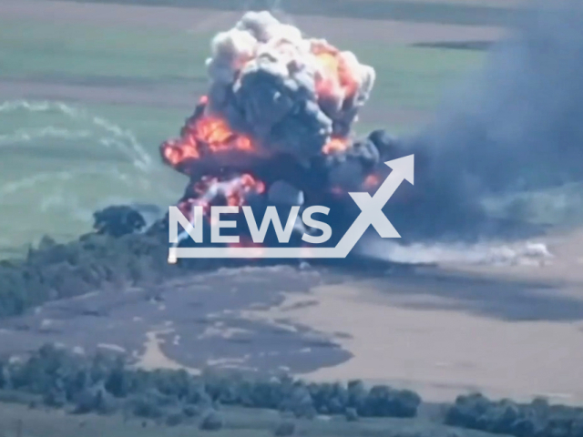 Picture shows a huge explosion and smoke on an open field in Ukraine in undated footage.
According the General Staff of the Armed Forces of Ukraine a Russian BTR-82 and field warehouse were destroyed by the 53rd separate mechanized brigade.
 Note: This picture is a screenshot from the video.
(@53brigade/Newsflash)