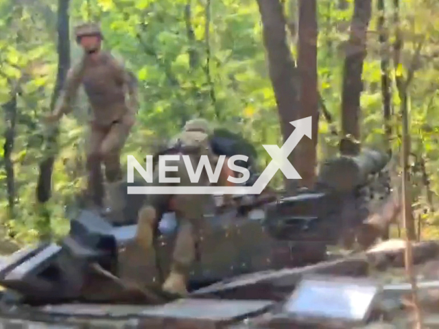 Ukrainian soldiers stand on Russian T-72B3 tank in Izyum direction, Ukraine in an undated photo. T-72B3 represents a relatively simple and effective upgrade of the T-72B tank, as a result of which the accuracy of firing has increased significantly compared to the base model. Note: picture is a screenshot from a video (@UkrainianLandForces/Newsflash)