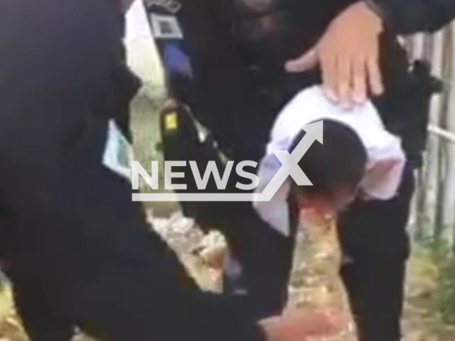 Police help a  newborn baby in Samambaia, Brazil, on Monday, Aug. 9, 2022. The baby choked while being breastfed. Note: Photo is a screenshot from the video (Policiais Militares do  Distrito Federal/Newsflash)