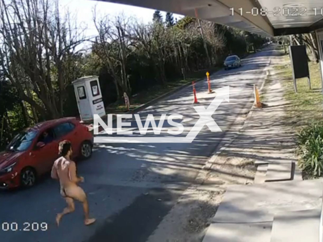 A man walks naked on the street in La Plata, Argentina, Thursday, Aug. 11, 2022. He was detained and transferred to the San Martín hospital. Note: This picture is a screenshot from the video (Newsflash).