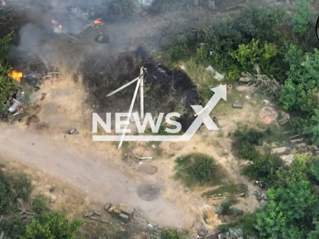 Russian mortar and boxes with ammunition stand on a road and under trees in a forest area of Maryinka, Donetsk region of Ukraine in an undated footage. The reconnaissance group K2 of the 54th separate mechanized brigade destroyed Russian occupiers' 120-mm mortar and their ammunition depot. Note: Picture is a screenshot from a video (@K2.54OMBr/Newsflash)