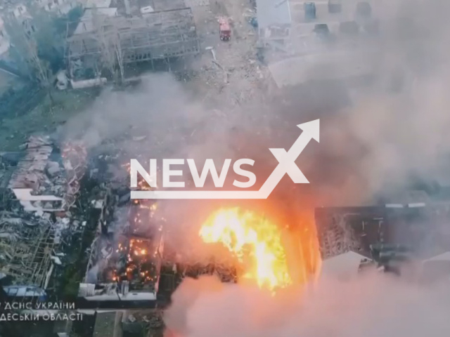 Buildings burn in one of the resorts of Odessa region, Ukraine, Wednesday, Aug. 17, 2022. As a result of the rocket strike, two recreation centers and two residential buildings were destroyed, walls, roofs and windows were broken in neighboring houses and outbuildings, four people were injured and hospitalized according to statement of the Odesa Regional Prosecutor's Office. Note: Picture is a screenshot from a video (@MNS.GOV.UA/Newsflash)