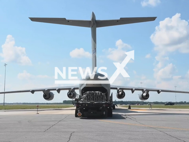 American Boeing C-17 Globemaster III stands near palletized explosives for Ukraine during a security assistance mission at Dover Air Force Base, Delaware, USA in an undated footage. Since 2014, the United States has committed more than $11.8 billion in security assistance to Ukraine. Note: Picture is a screenshot from a video (@DeptofDefense/Newsflash)