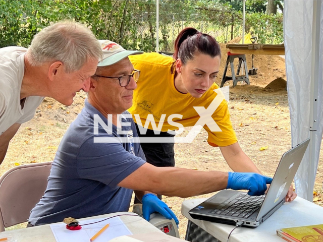 Archaeologist Dana Linck, forensic dentist Stuart Alexander and New Jersey State Police forensic anthropologist Anna Delaney confer at the Red Bank Battlefield Archaeology Project excavation in undated photo. Archaeologists uncovered remains of what they believe are 14 individuals at Revolutionary War Battlefield. Note: Photo provided by Rowan University. (Courtesy of Rowan University/Newsflash)