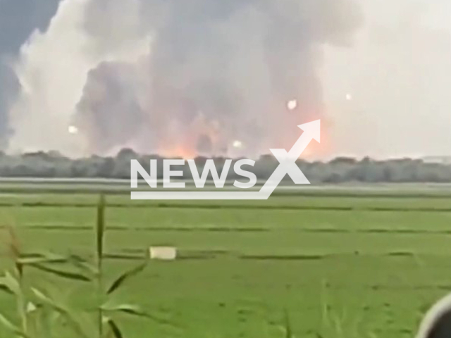 Fire and smoke in the air from the ammunition depot explosion in Crimea in peninsula in Eastern Europe on Tuesday Aug. 16, 2022. According to the "head of the government" of Crimea, Serhiy Aksyonov, two civilians were injured as a result of the detonation in the Dzhankoy district. Note: Photo is a screenshot from the video (@ChernihivTCKtaSP/Newsflash)