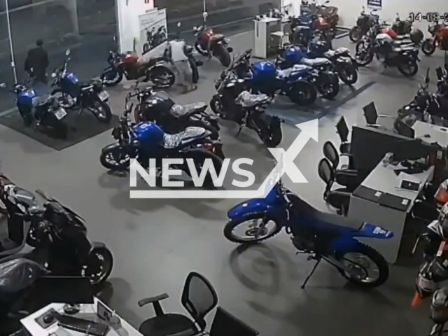 A group of thieves stealing motorcycles from a store in  Sao Bernardo do Campo, Brazil, on Sunday, Aug. 14, 2022. A total of seven motorcycles were stolen by 11 people. Note: Picture is a screenshot from a video (Newsflash)