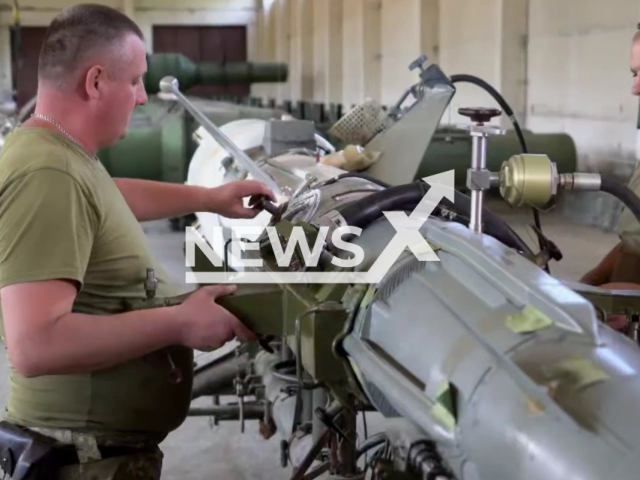 Missile logisticians of one of the divisions of the Logistics Forces Command of AFU work with military equipment in a workshop in Ukraine in an undated footage. From beginning of war in Ukraine to today, they have exceeded the task of the annual plan to provide missile and artillery weapons by 600 percent. Note: Photo is a screenshot from the video (@GeneralStaff.ua/Newsflash)