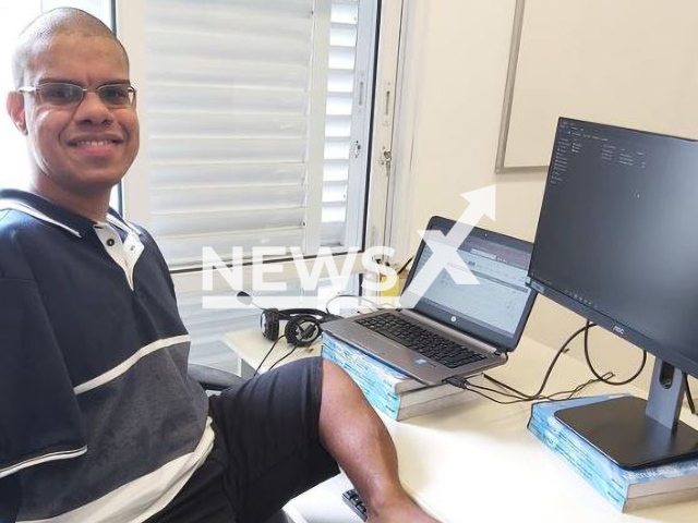 Brazilian programmer Diogo Alves da Silva, 26, known as Diogo Pe, posing in an undated photo. Diogo was born without arms and uses  his feet to work on the computer.
Note: Private photo.  (@diogoalvespe/Newsflash)