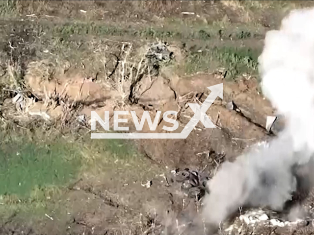 Picture shows an explosion in a field area in Ukraine in an undated footage. As a result of the attack of the 11th regiment of the NM DPR, the Ukrainian personnel were liquidated, and Ukrainian stronghold and fortified dugouts were destroyed. Note: This picture is a screenshot from the video (@nm_dnr/Newsflash).