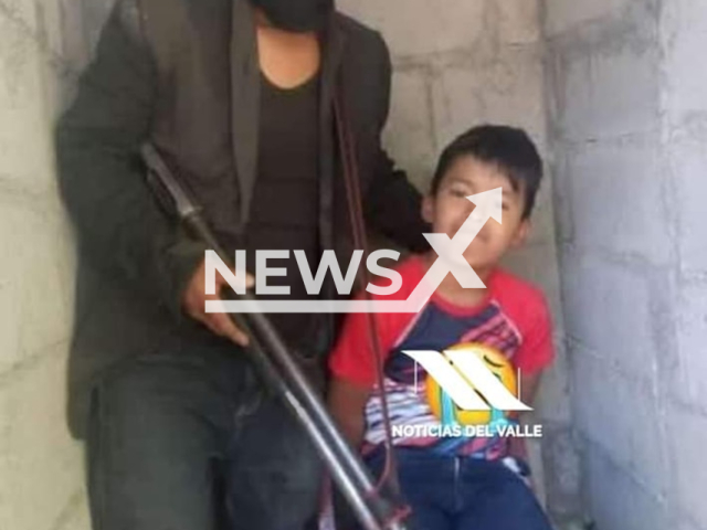 Victim Freddy Eliseo Mendez Pablo, 11, with one of the kidnapers in Colotenango, Guatemala, undated. The kidnapers were lynched and burned alive. Note: Private photo.  (Newsflash)