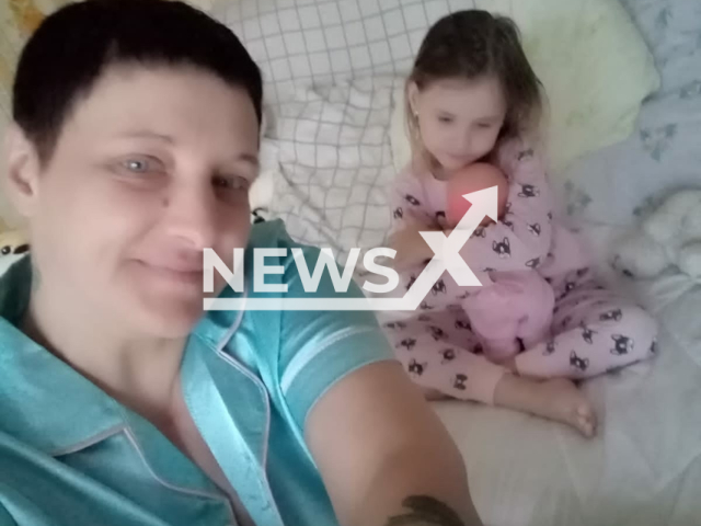 Taisia Nosova, 45, poses together with her five-year-old daughter in an undated photo. They were allegedly killed in Perm, Russia. Note: Picture is private (Newsflash)