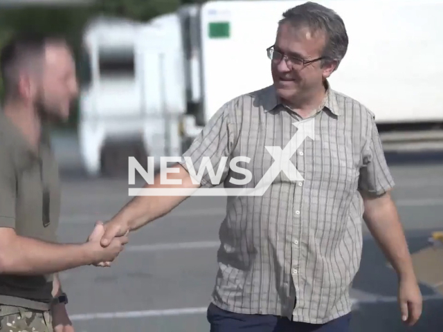 Paul Zakovsky, a volunteer from Great Britain, shakes hands with Ukrainian soldier in Ukraine in undated footage. Paul collected and gave almost a full truckload of necessary items for the military of one of the units of the Northern Association of the National Guard. Note: Picture is a screenshot from a video (@NGUmainpage/Newsflash)