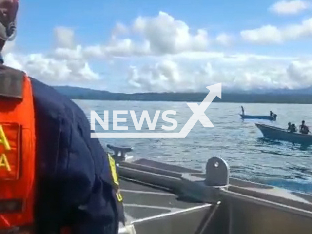 Picture shows Colombian Navy Coast Guard boats heading toward the trapped whale, in Bahia Solano, Colombia, undated. They manged to remove part of the net, and the animal swam away. Note: Picture is a screenshot from a video (Armada de Colombia/Newsflash)