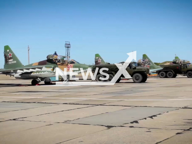 Russian  aircraft and military vehicles stand at the Sergeevsky training ground, in Primorsky Krai, Russia in undated footage. The crews of Su-25SM3 attack aircraft and Su-24MR reconnaissance aircraft of the operational-tactical aviation of the Eastern Military District, as part of the Vostok-2022 maneuvers, worked out the tasks of air support for troops. Note: This picture is a screenshot from the video (@mod_russia/Newsflash)