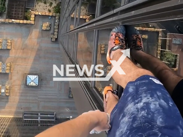 Alexis Landot, 22, climbs the Mercuriales tower with no safety gear, in Paris, France, on Saturday, Aug. 20, 2022. Mr. Landot has been solo climbing skyscrapers for over two years now. Note: Picture is a screenshot from a video (@alexis.landot/Newsflash)