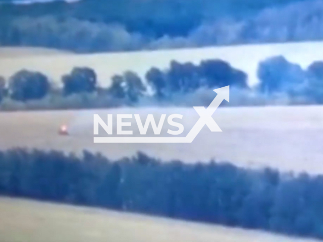 Russian tank burns in an open field in Ukraine in undated footage.
According the Ukrainian military authorities the tank was destroyed by the soldiers from the 14th separate mechanized brigade named after Prince Roman the Great.
Note: This picture is a screenshot from the video.
(@14ombr/Newsflash)