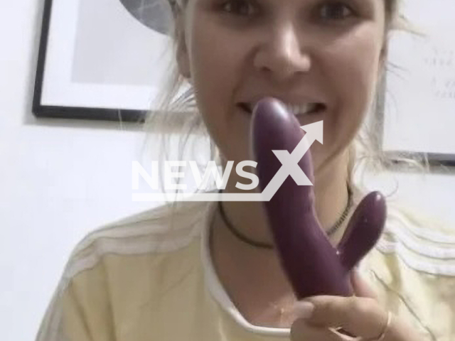 German model and television actress Sara Kulka, 32, poses with a sex toy in undated photo. She showed her fans the intimate product when she was asked to reveal her "new lover" in September, 2022. Note: Photo is a screenshot from a video. (@sarakulka_/Newsflash)