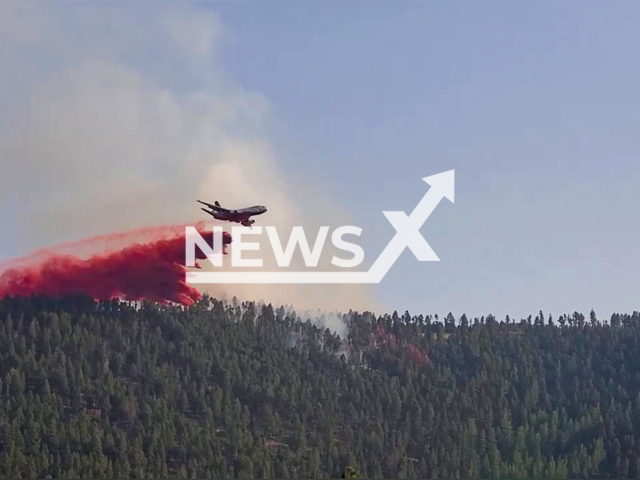 Photo showing the Arrastra fire east of Helmville, Montana, USA. Note: Photo is a screenshot from the video (@lincolnfirerescue/Newsflash)